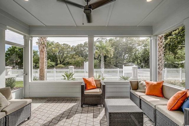 sunroom with a wealth of natural light and ceiling fan