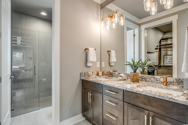 bathroom with tile patterned flooring, vanity, and an enclosed shower