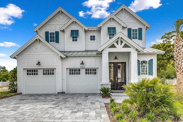 view of front of property featuring french doors and a garage