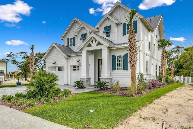 view of front of home featuring a garage and a front yard