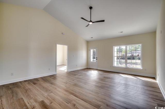 interior space with wood finished floors, baseboards, visible vents, high vaulted ceiling, and ceiling fan