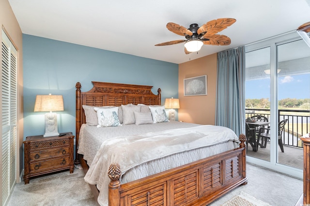 carpeted bedroom with ceiling fan and access to exterior