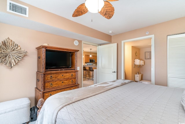 bedroom with ceiling fan and connected bathroom