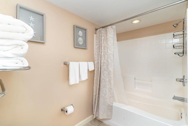 bathroom with tile patterned floors and shower / bath combo