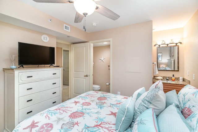 bedroom featuring ceiling fan and ensuite bathroom