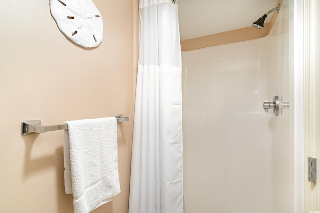 bathroom with a shower with shower curtain