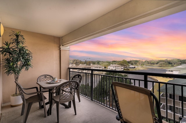 view of balcony at dusk