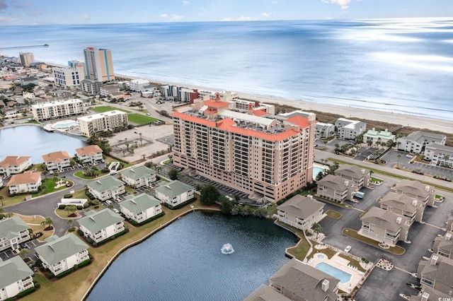 bird's eye view with a water view and a view of the beach