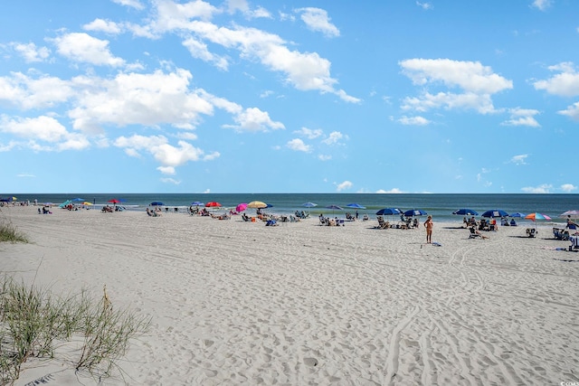 view of water feature with a beach view