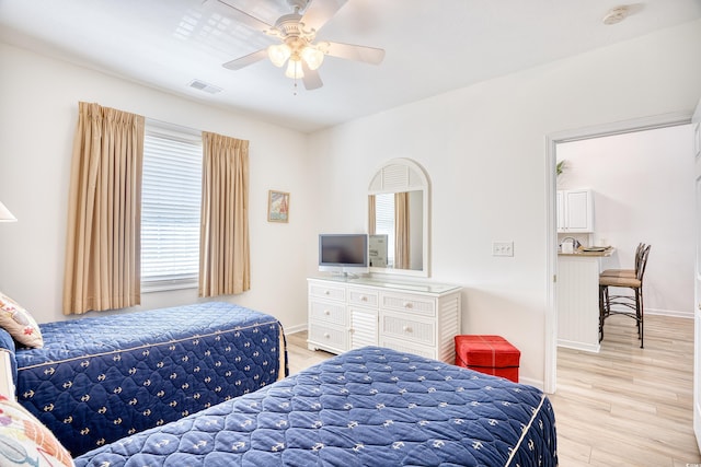 bedroom featuring light hardwood / wood-style floors and ceiling fan