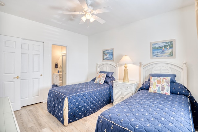 bedroom with ceiling fan, light hardwood / wood-style floors, and ensuite bathroom