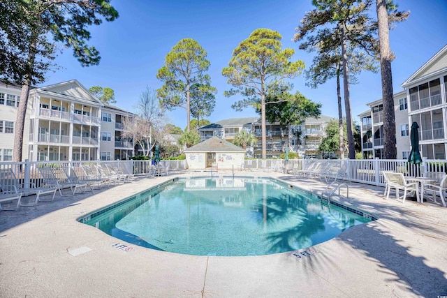 view of swimming pool featuring a patio area