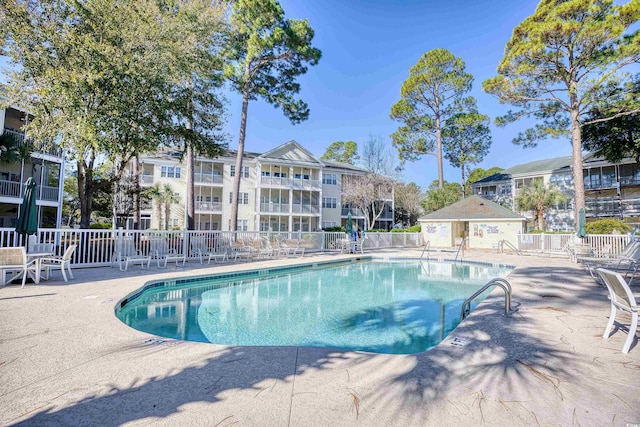 view of swimming pool with a patio area