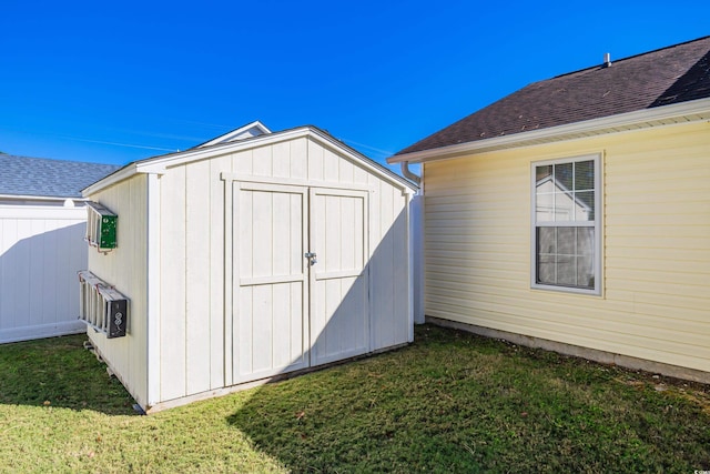 view of outdoor structure with a lawn