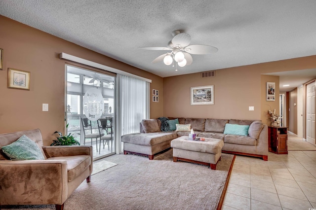 2226 Huntington Dr Unit D, Surfside Beach, SC 29575 - living area with ceiling fan, light tile patterned floors, and a textured ceiling