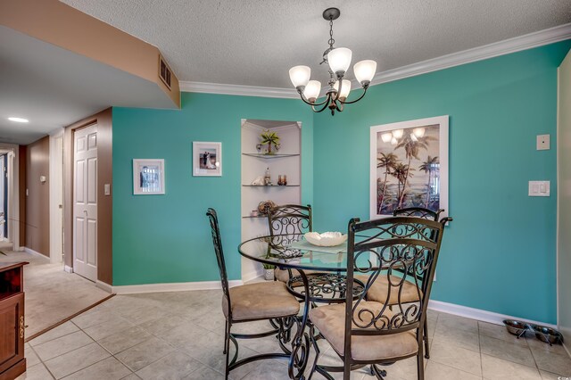 2226 Huntington Dr Unit D, Surfside Beach, SC 29575 - dining area with ornamental molding, a textured ceiling, light tile patterned floors, a chandelier, and baseboards