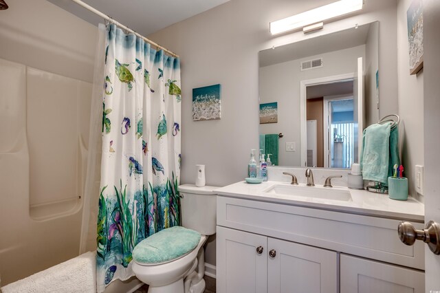 2226 Huntington Dr Unit D, Surfside Beach, SC 29575 - full bath featuring toilet, vanity, and shower / bath combo with shower curtain