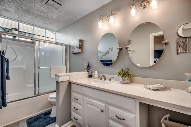 2226 Huntington Dr Unit D, Surfside Beach, SC 29575 - bathroom featuring vanity, toilet, bath / shower combo with glass door, and a textured ceiling