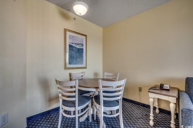 dining area with a textured ceiling