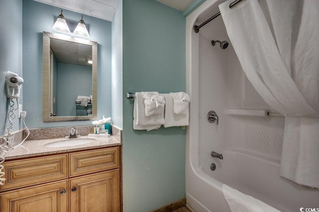 bathroom with shower / bath combo and vanity