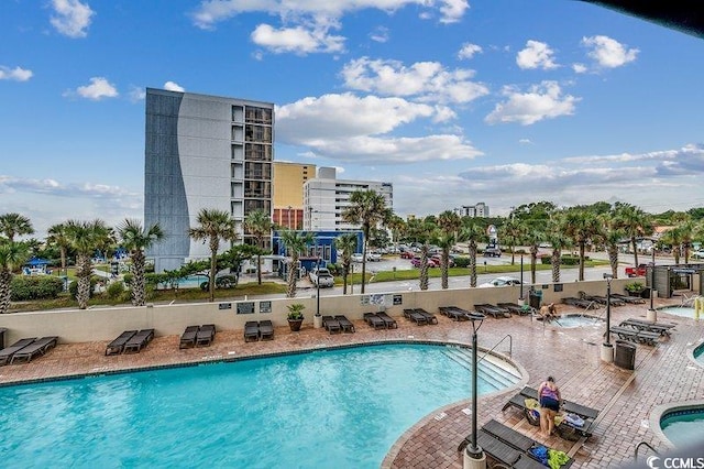 view of swimming pool with a patio