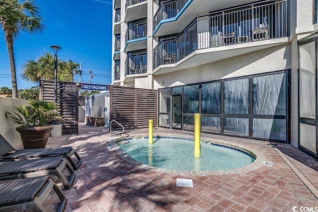 view of swimming pool featuring a patio area