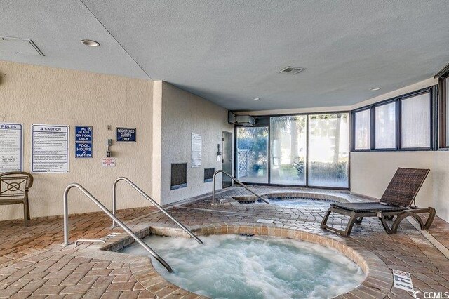 view of pool with an indoor in ground hot tub