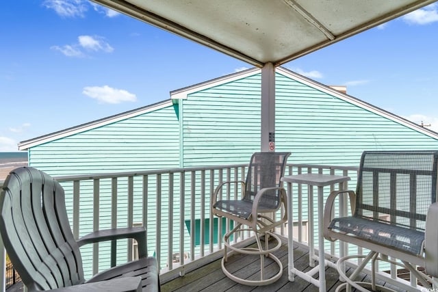 wooden terrace featuring a water view