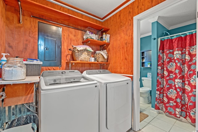 laundry area featuring independent washer and dryer, laundry area, tile patterned floors, ornamental molding, and electric panel