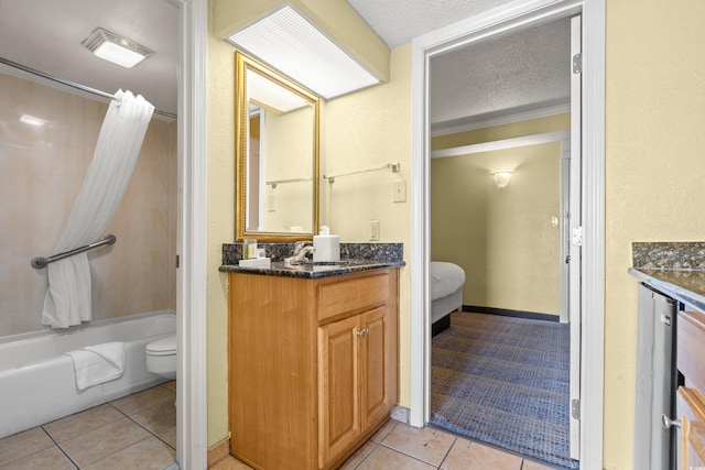 bathroom featuring toilet, shower / tub combo, a textured ceiling, vanity, and tile patterned flooring