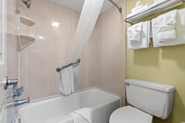 bathroom with toilet and shower / bath combo with shower curtain