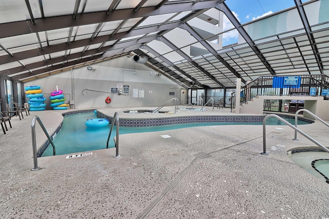 community pool featuring an indoor in ground hot tub, a patio, and stairway