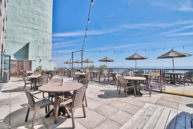 view of patio featuring a water view