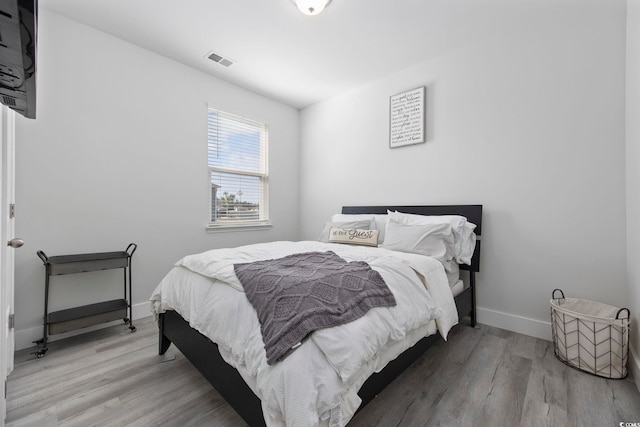 bedroom featuring light hardwood / wood-style flooring