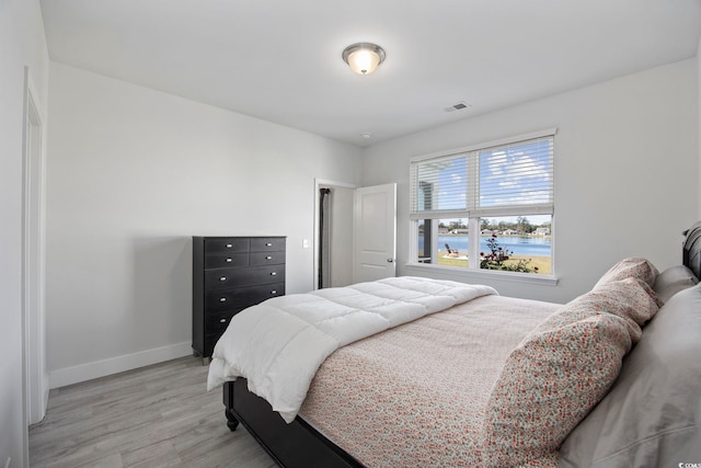 bedroom featuring light wood-type flooring