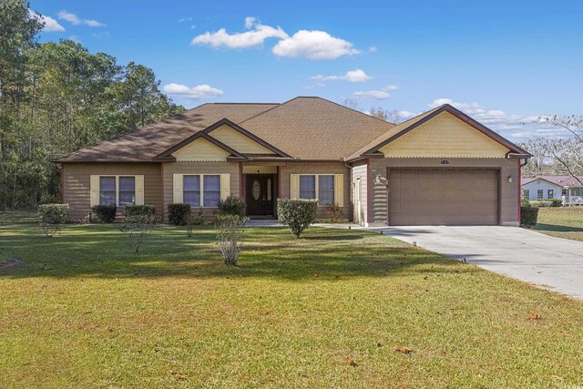 view of front facade featuring a garage and a front lawn