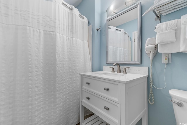 300 N Ocean Blvd Unit 128, North Myrtle Beach, SC 29582 - bathroom featuring a shower with shower curtain, vanity, and toilet