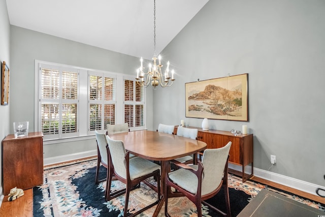 4491 Horseshoe Bnd, Murrells Inlet, SC 29576 - dining area featuring a chandelier, wood finished floors, baseboards, and high vaulted ceiling