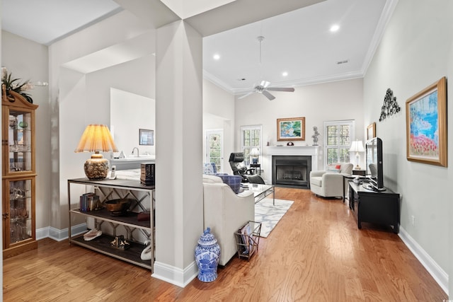 4491 Horseshoe Bnd, Murrells Inlet, SC 29576 - living room with ceiling fan, a high ceiling, wood finished floors, crown molding, and a fireplace