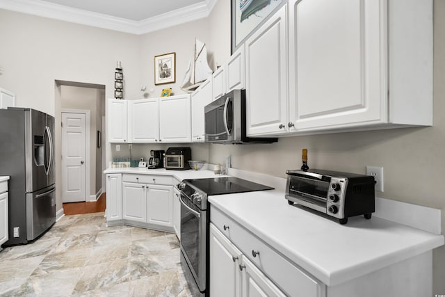 4491 Horseshoe Bnd, Murrells Inlet, SC 29576 - kitchen with stainless steel appliances, ornamental molding, white cabinetry, light countertops, and baseboards