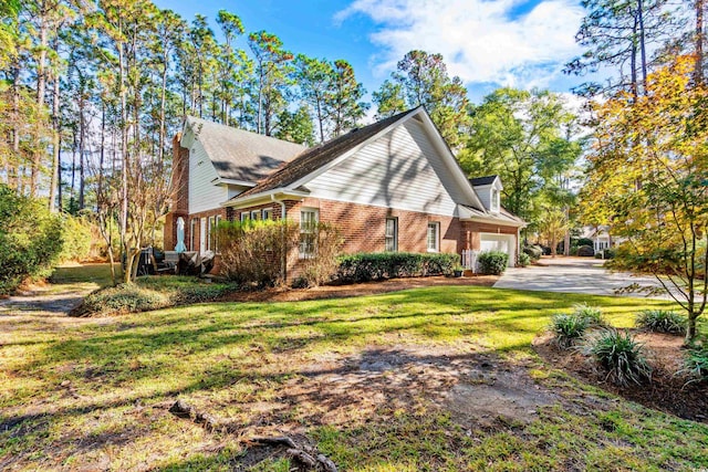 4491 Horseshoe Bnd, Murrells Inlet, SC 29576 - view of side of home with an attached garage, brick siding, a lawn, and driveway
