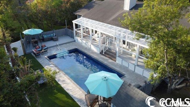 view of swimming pool featuring a patio