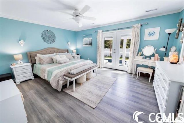 bedroom featuring access to outside, ceiling fan, french doors, and dark wood-type flooring