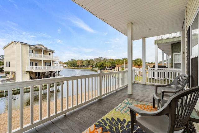 deck featuring a water view