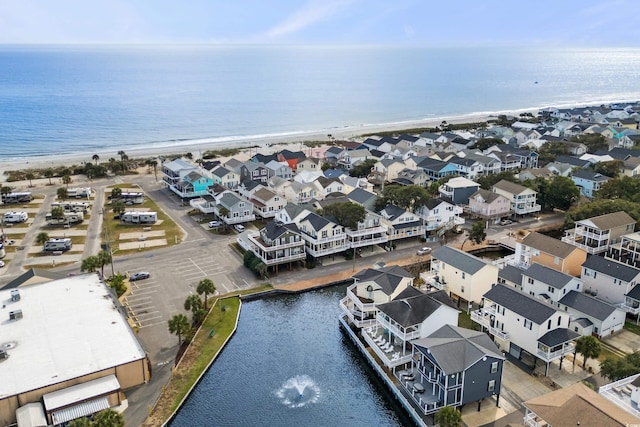 aerial view featuring a water view and a beach view