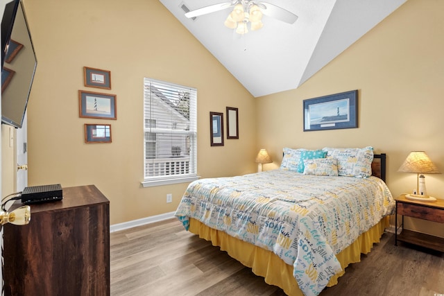 bedroom with hardwood / wood-style flooring, ceiling fan, and lofted ceiling