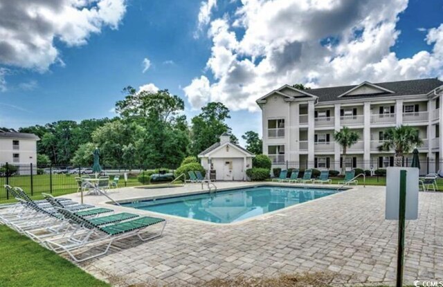 view of swimming pool featuring a patio