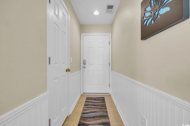 doorway featuring light tile patterned floors