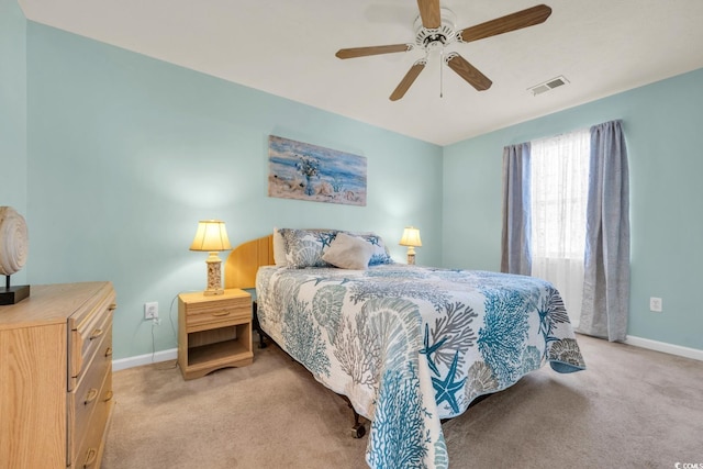 bedroom featuring ceiling fan and light colored carpet