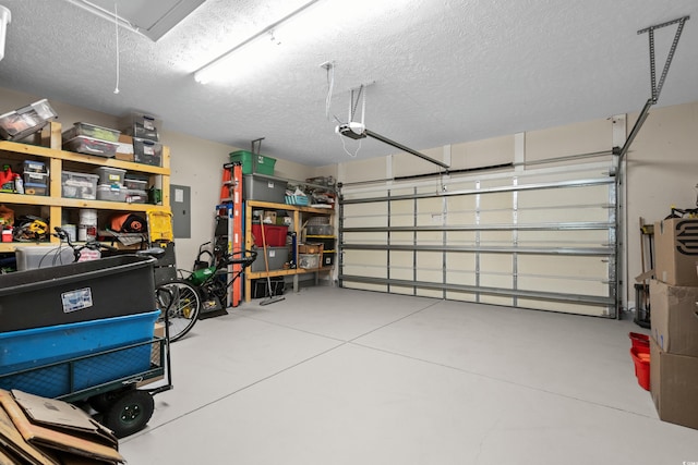 garage featuring a garage door opener and electric panel